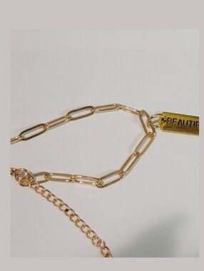 18kgp Stainless Steel Bracelet With "Beautiful" Charm.